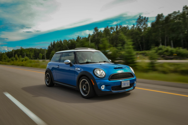 MINI Cooper driving on road