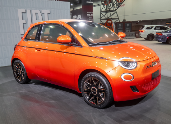 orange fiat 500e in showroom