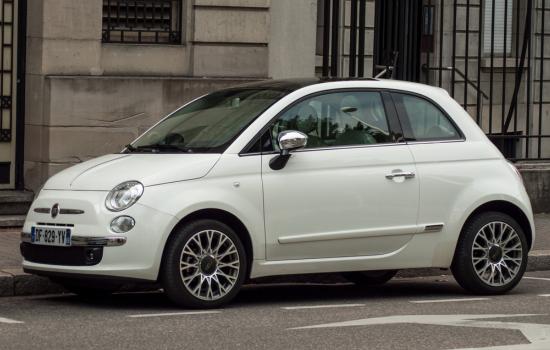 white fiat 500 parked on road