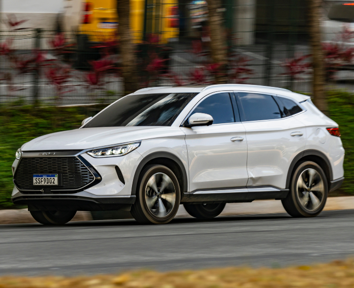 white plug in hybrid car on road