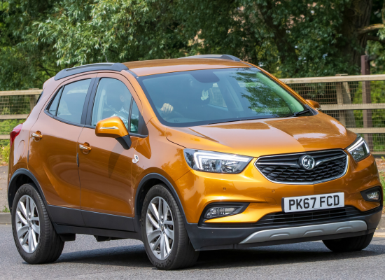 orange vauxhall mokka on road