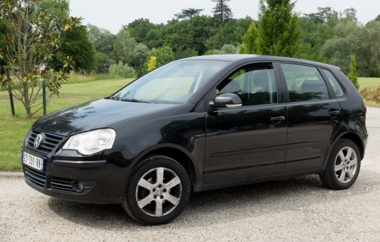 black volkswagen gold parked